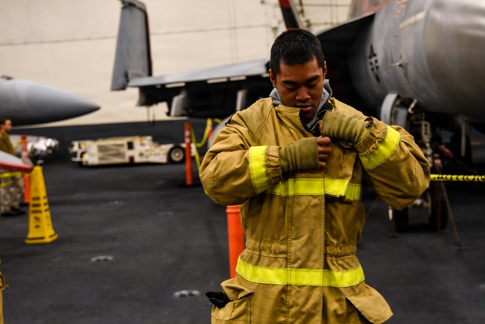 U.S. Navy Sailors Participate in a General Quarters Drill