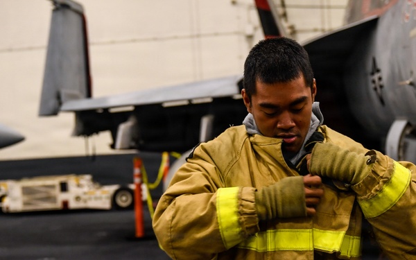 U.S. Navy Sailors Participate in a General Quarters Drill