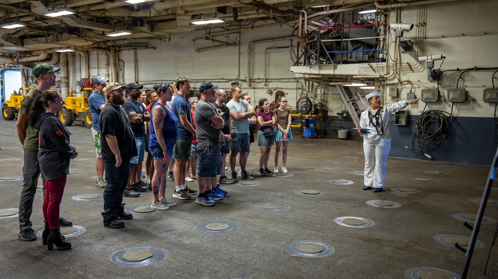 Sailor gives a tour aboard Wasp-class amphibious assault ship USS Iwo Jima (LHD 7)