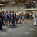 Sailor gives a tour aboard Wasp-class amphibious assault ship USS Iwo Jima (LHD 7)