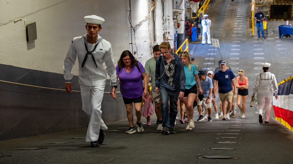 Sailor gives a tour aboard Wasp-class amphibious assault ship USS Iwo Jima (LHD 7)