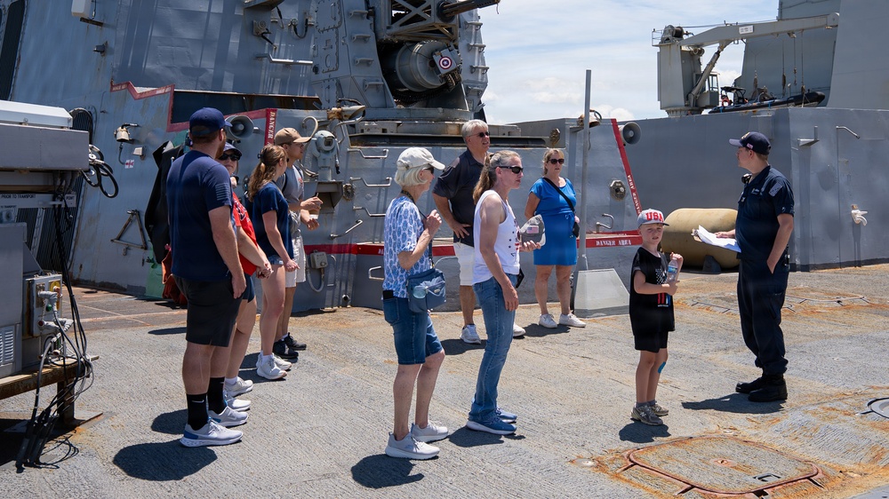 Sailor conducts a tour aboard Arleigh Burke-class guided-missile destroyer USS Bainbridge (DDG 96)