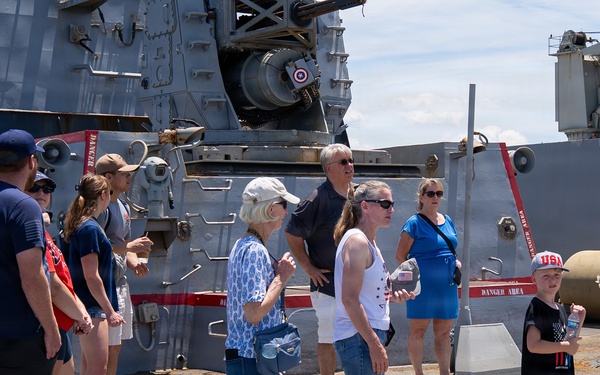 Sailor conducts a tour aboard Arleigh Burke-class guided-missile destroyer USS Bainbridge (DDG 96)