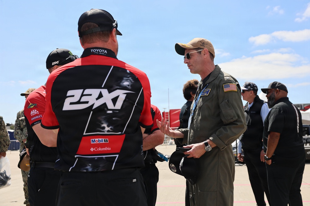 Naval Base Coronado Leaders meet NASCAR racer Riley Herbst's team