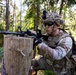 U.S. Army Soldier takes cover behind log obstacle during Spectrum Blitz 26