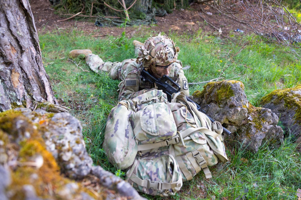 U.S. Army soldier takes covered position during Spectrum Blitz 26