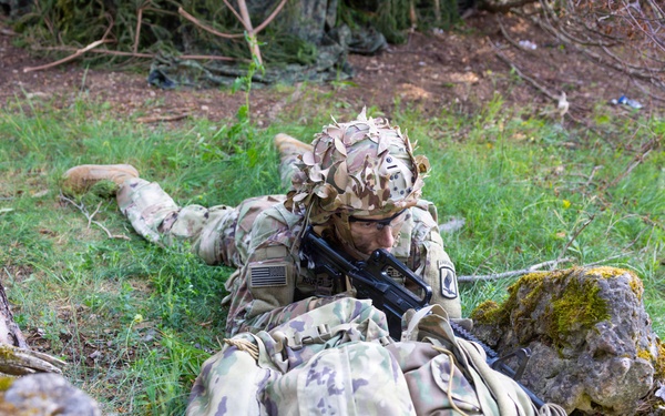 U.S. Army soldier takes covered position during Spectrum Blitz 26