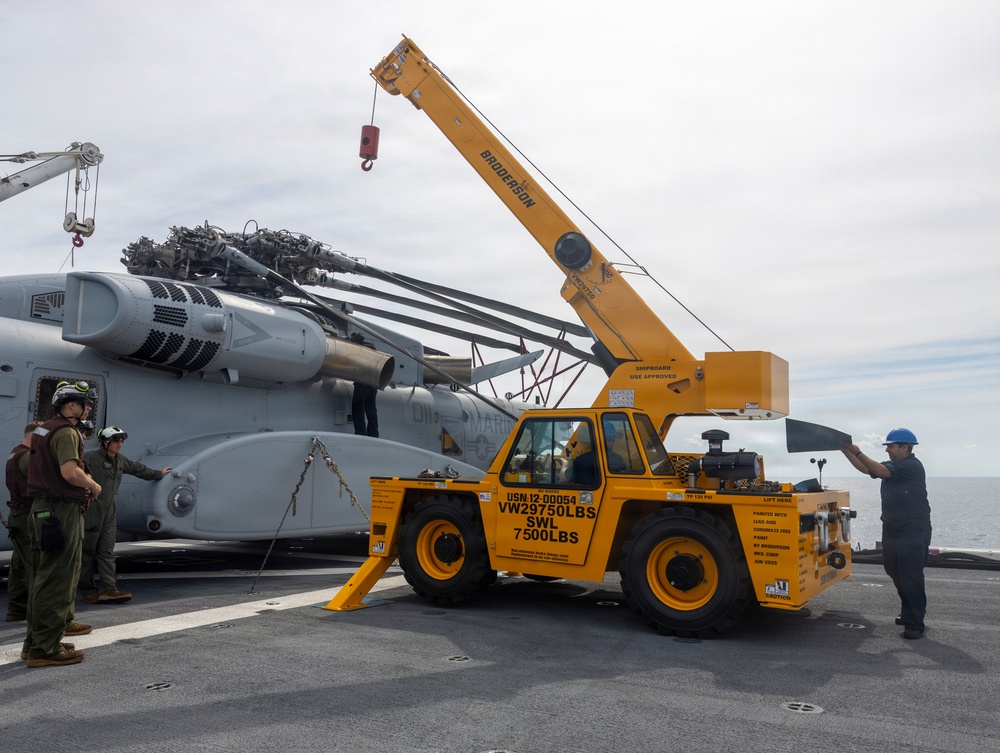 26th Marine Expeditionary Unit’s Type Commander’s Amphibious Training | HMH-461 and Sailors conduct crane operations aboard the USS Kearsarge