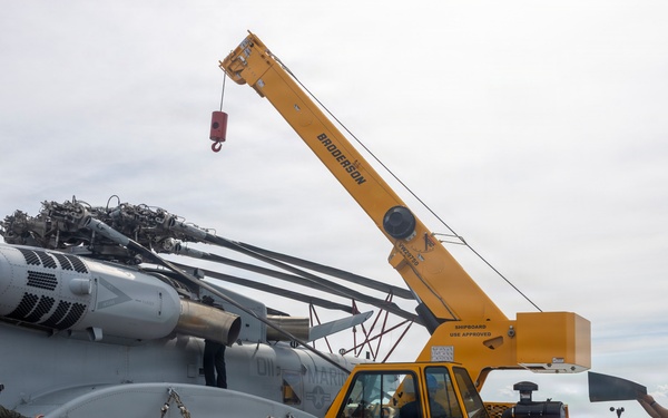 26th Marine Expeditionary Unit’s Type Commander’s Amphibious Training | HMH-461 and Sailors conduct crane operations aboard the USS Kearsarge
