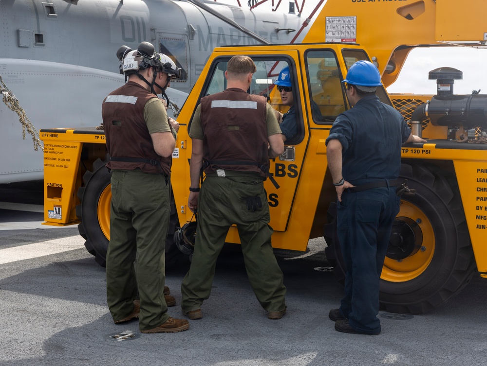 26th Marine Expeditionary Unit’s Type Commander’s Amphibious Training | HMH-461 and Sailors conduct crane operations aboard the USS Kearsarge