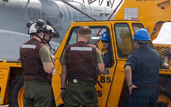26th Marine Expeditionary Unit’s Type Commander’s Amphibious Training | HMH-461 and Sailors conduct crane operations aboard the USS Kearsarge