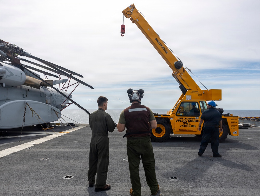 26th Marine Expeditionary Unit’s Type Commander’s Amphibious Training | HMH-461 and Sailors conduct crane operations aboard the USS Kearsarge