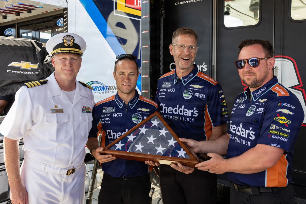 Kyle Busch's team receives ceremonial flag during NASCAR San Diego Weekend
