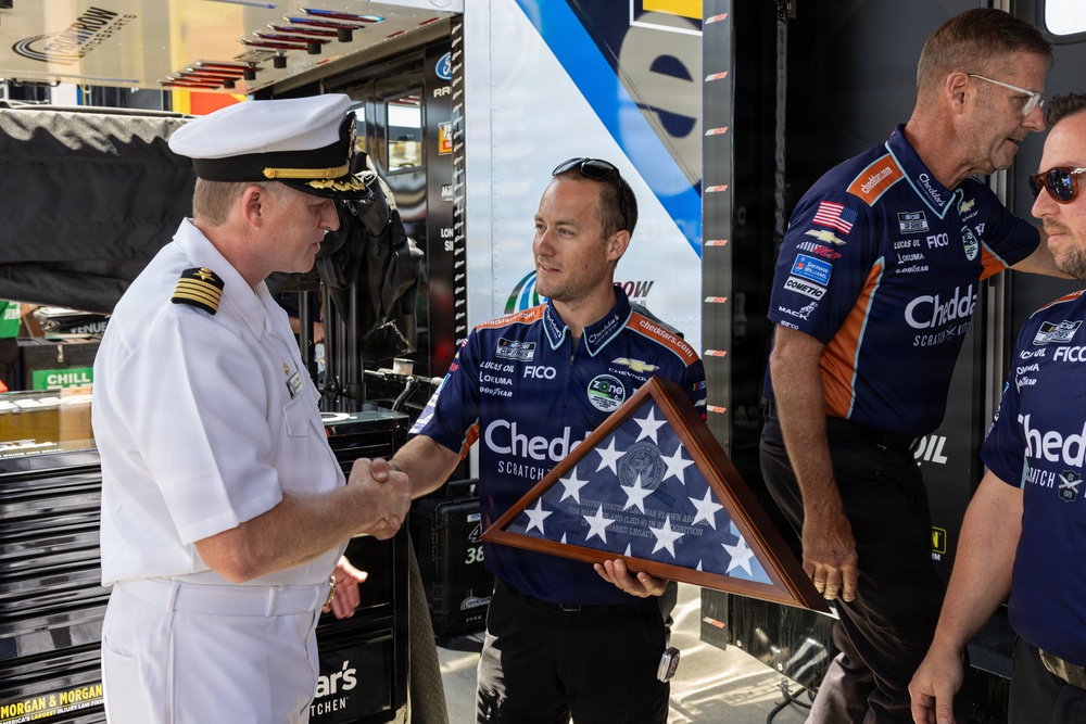 Kyle Busch's team receives ceremonial flag during NASCAR San Diego Weekend