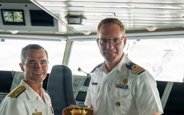 Vice Adm. Doug Perry, Commander, U.S. 2nd Fleet, Accepts a Placard from the Commanding Officer of the Royal Netherlands Navy's Combat Support Ship HNLMS Den Helder