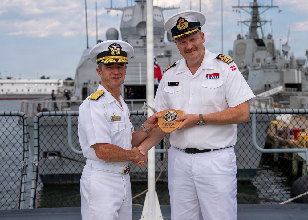 Vice Adm. Doug Perry, commander, U.S. 2nd Fleet, presents a placard to the commanding officer of the Royal Danish Navy frigate HDMS Iver Huitfeldt