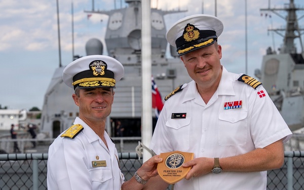 Vice Adm. Doug Perry, commander, U.S. 2nd Fleet, presents a placard to the commanding officer of the Royal Danish Navy frigate HDMS Iver Huitfeldt