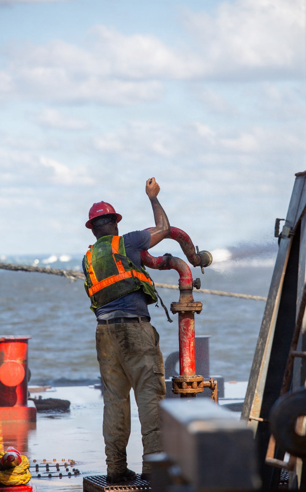 Curtin crew members perform equipment maintenance