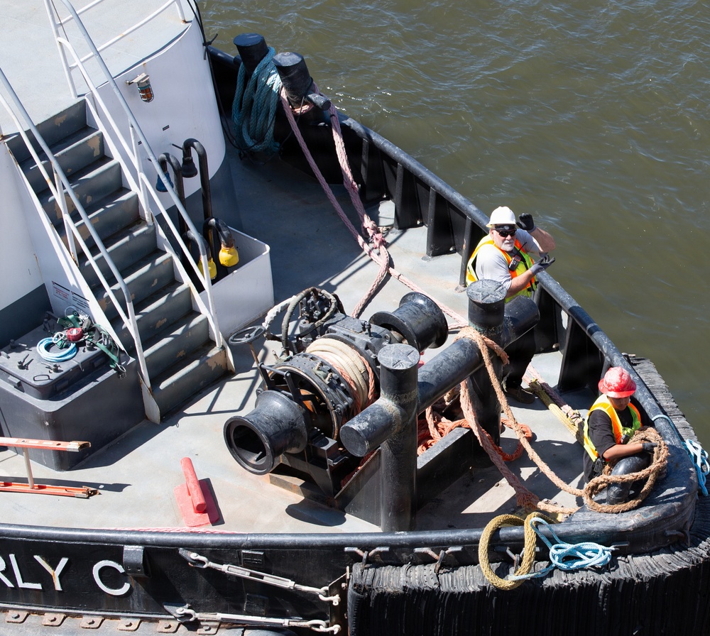 Curtin crew members perform equipment maintenance