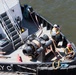 Curtin crew members perform equipment maintenance