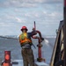Curtin crew members perform equipment maintenance