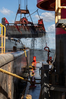 Curtin crew members perform equipment maintenance