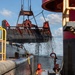Curtin crew members perform equipment maintenance