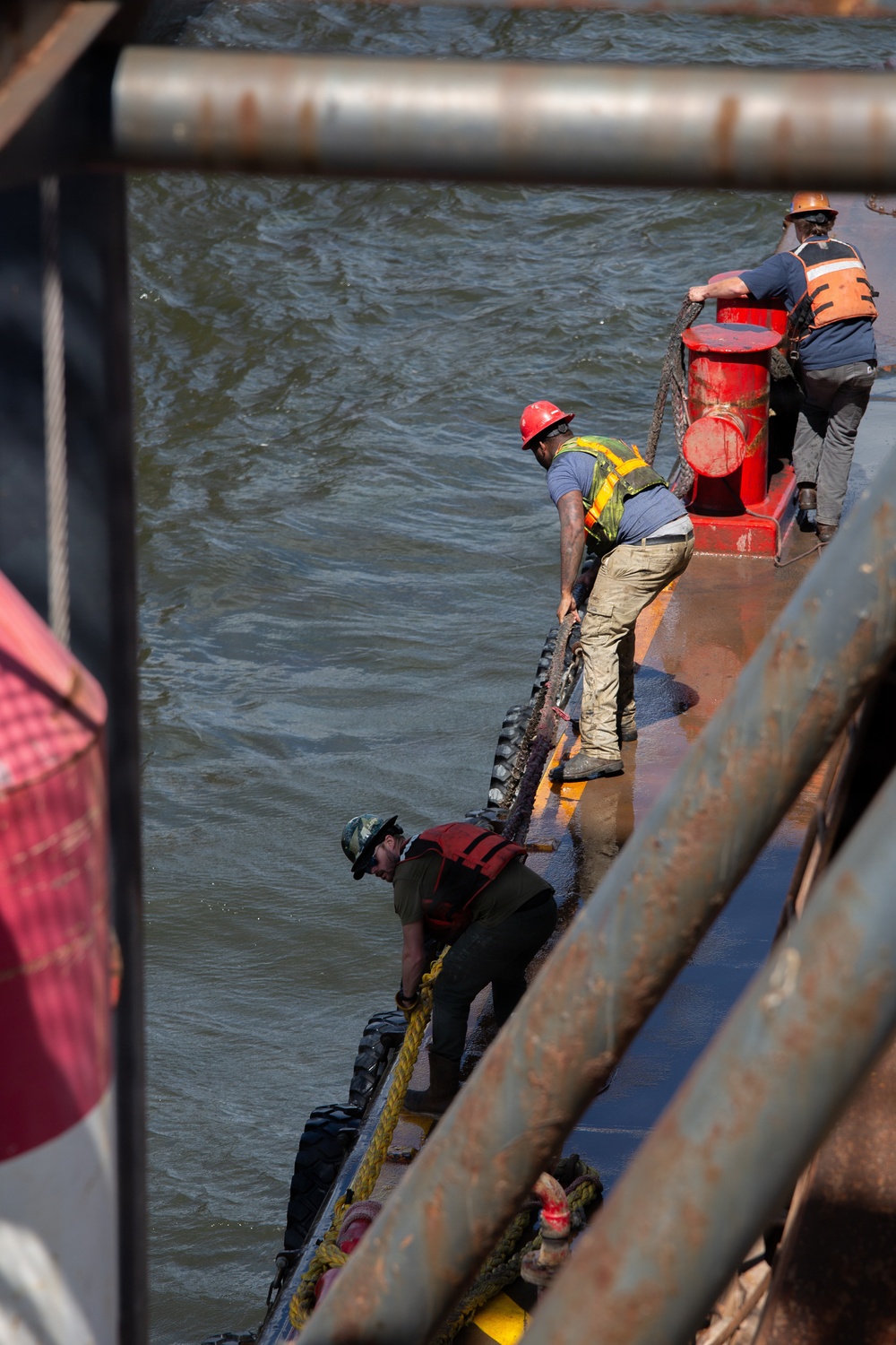 Curtin crew members perform equipment maintenance