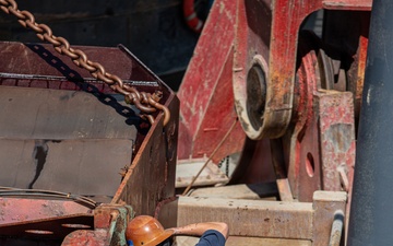 Curtin crew members perform equipment maintenance