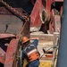 Curtin crew members perform equipment maintenance