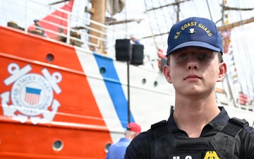 U.S. Coast Guard Petty Officer 3rd Class Gavin Stites stands watch for the Coast Guard Cutter Eagle