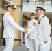 Rear Adm. Tony Rossi, left, shakes hands with incoming PMA-260 program manager Capt. James Bailey at PMA-260 change of command ceremony