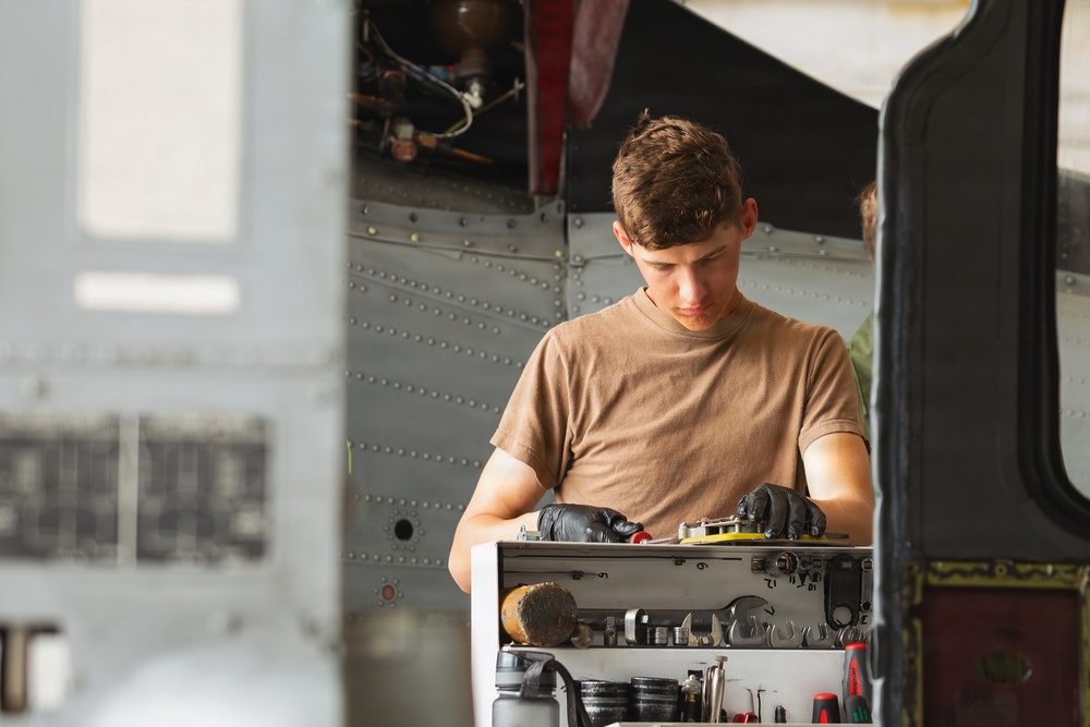 Sailors at Air Test and Evaluation Squadron One perform maintenance
