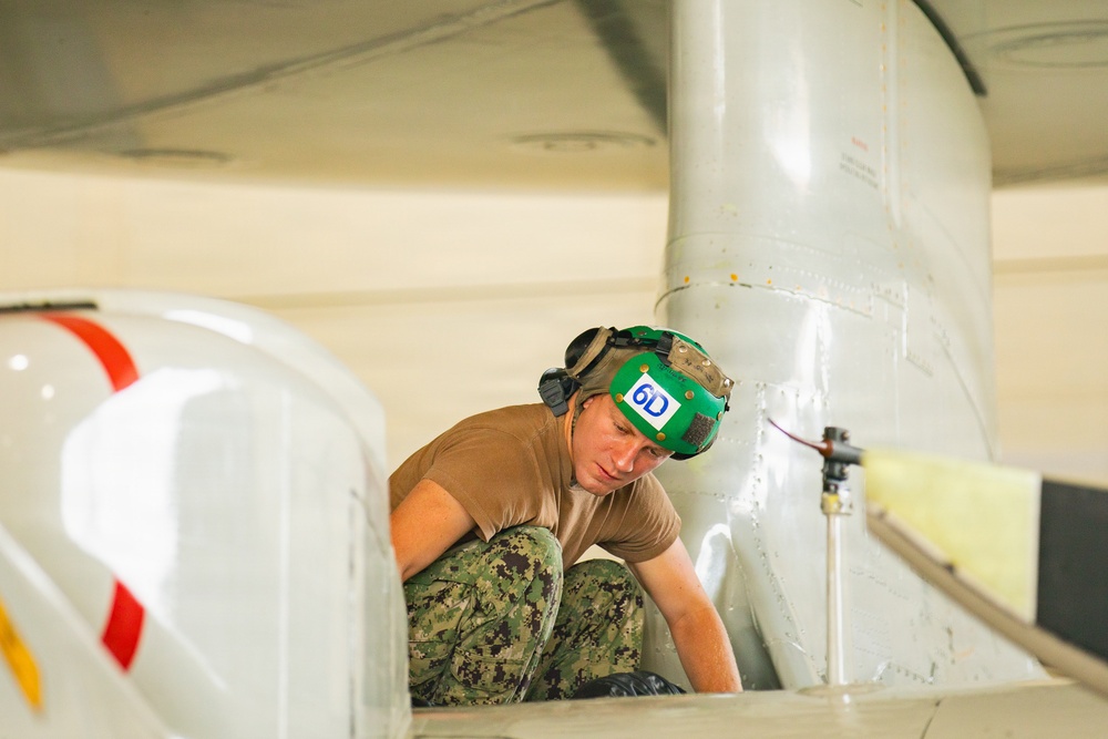Sailors at Air Test and Evaluation Squadron One perform maintenance