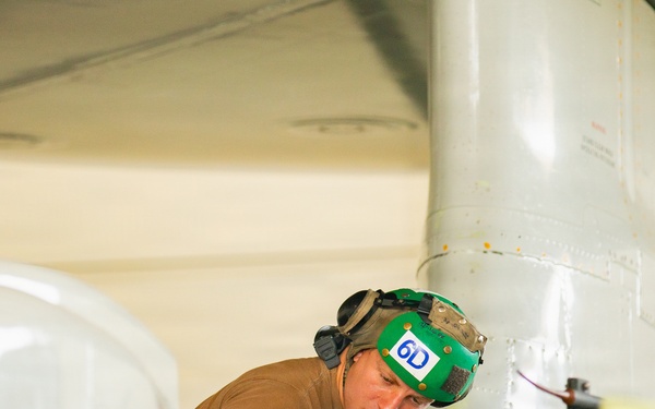 Sailors at Air Test and Evaluation Squadron One perform maintenance