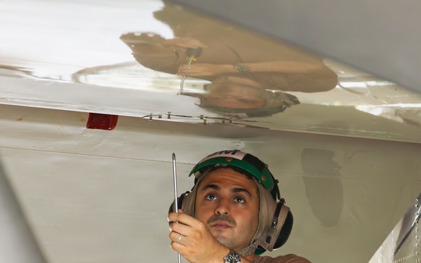 Sailors at Air Test and Evaluation Squadron One perform maintenance