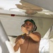 Sailors at Air Test and Evaluation Squadron One perform maintenance