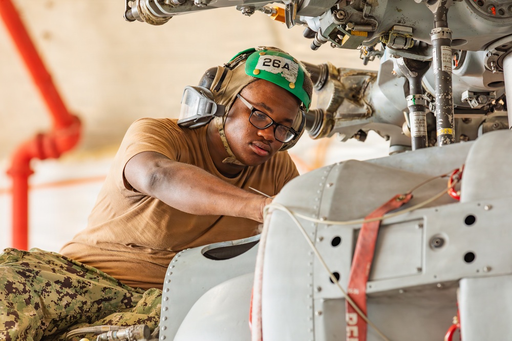 Sailors at Air Test and Evaluation Squadron One perform maintenance