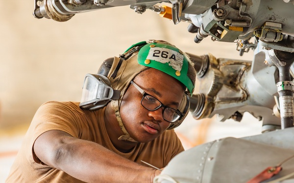 Sailors at Air Test and Evaluation Squadron One perform maintenance
