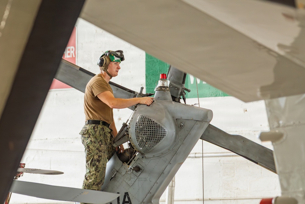 Sailors at Air Test and Evaluation Squadron One perform maintenance