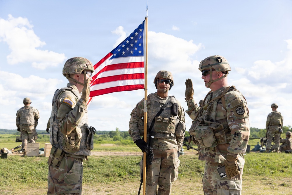 Iowa National Guard brigadier general reenlists soldier during annual training