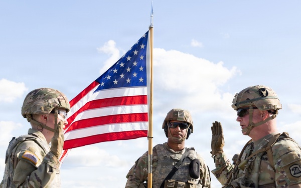 Iowa National Guard brigadier general reenlists soldier during annual training