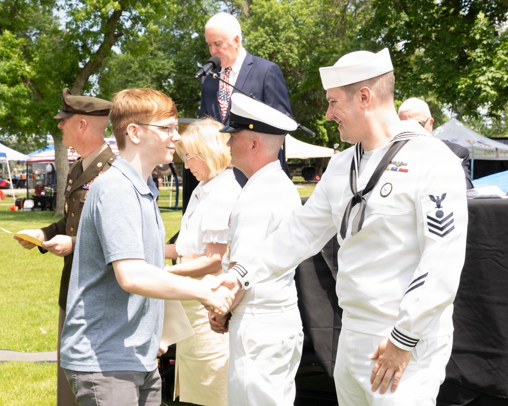 Future service members are recognized at an Our Community Salutes event at Rock Island
