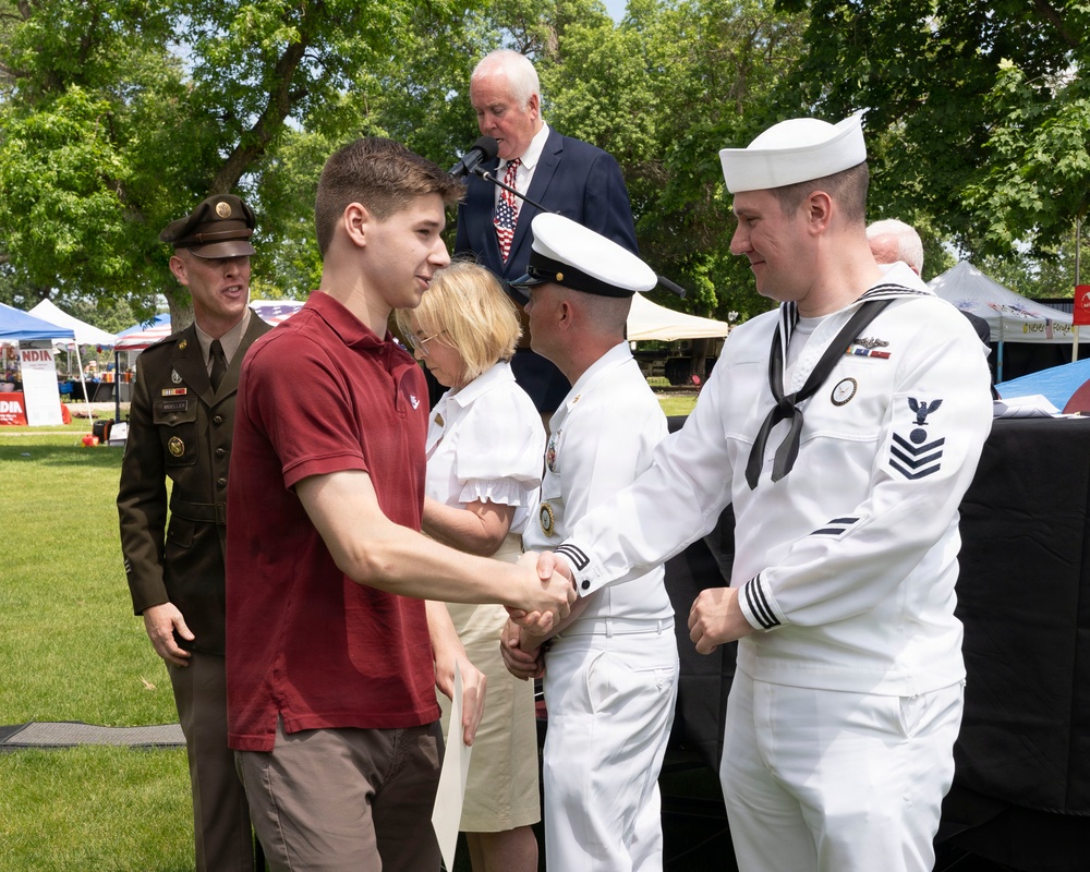 Future service members are recognized at an Our Community Salutes event at Rock Island