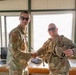 Iowa National Guard brigadier general presents challenge coin to 1034th CSSB soldier