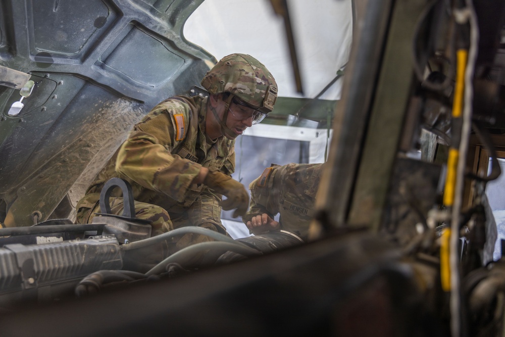 Iowa National Guard soldier performs vehicle maintenance during annual training
