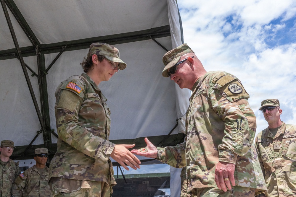 1034th CSSB Soldier receives challenge coin during annual training