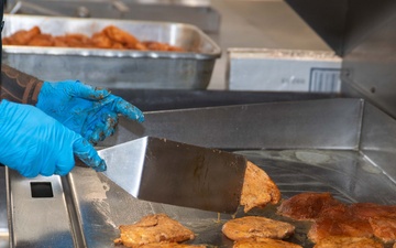 Ronald Reagan Sailors Prepare Food For Opening Of Ships Galley
