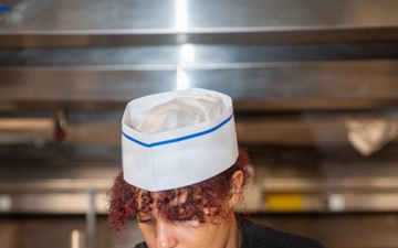 Ronald Reagan Sailors Prepare Food For Opening Of Ships Galley