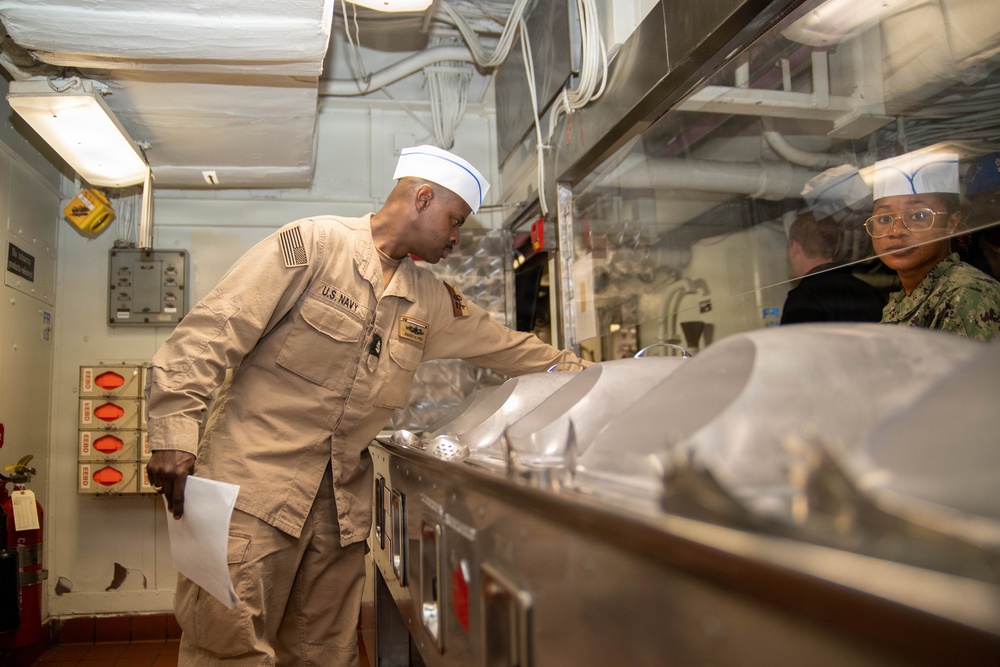 Ronald Reagan Sailors Prepare Food For Opening Of Ships Galley